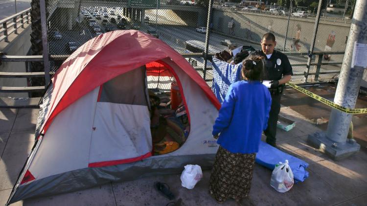 Police swept the homeless off their village above the 101 Freeway last week in Los Angeles. (Mark Boster/Los Angeles Times)